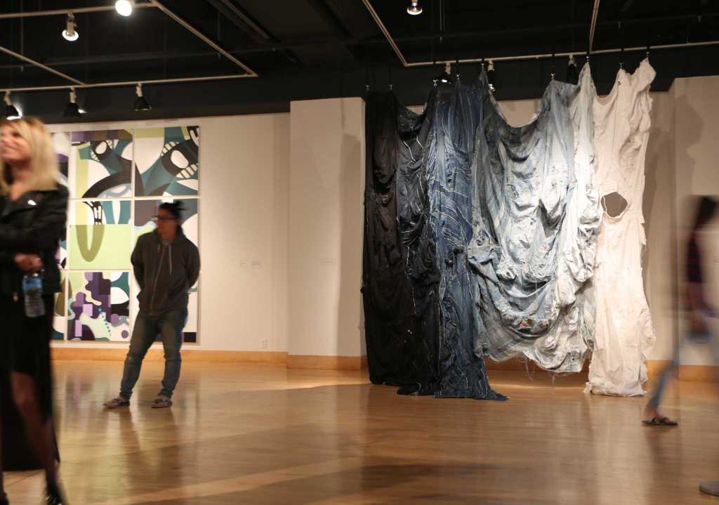 Students and guests viewing artwork